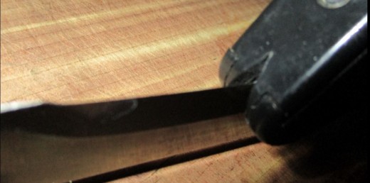 pull sharpener one direction towards end of blade