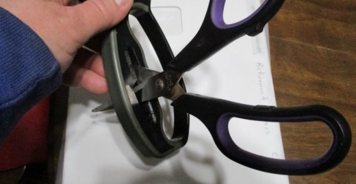 The side offers a scissor sharpening tool