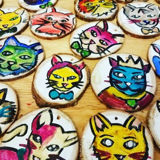 Ornaments I made of various styles of cats in wild colors.