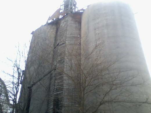 Here's a retired grain elevator alongside a bicycle trail that was once a railroad track. Note the chute in the foreground which was once used for loading rail cars with grain.