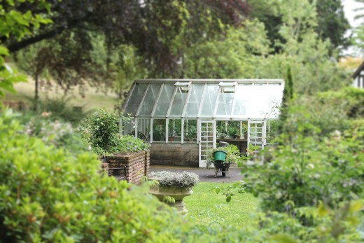 A green house nestled in a secret location to please the desires of this gardener. 