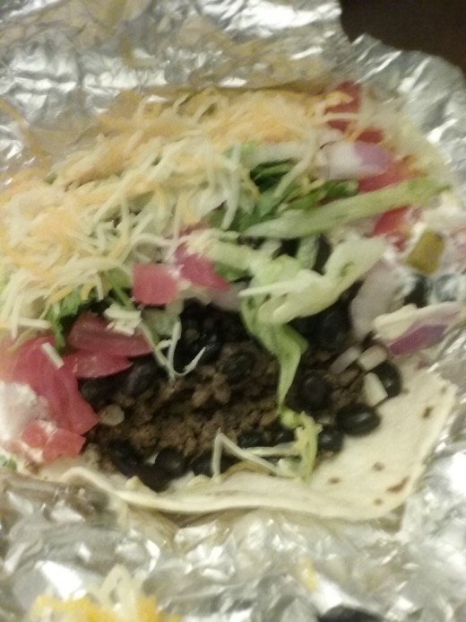Black beans, refreshing and crisp lettuce, juicy tomatoes and shredded cheese are all great toppings to request for the tacos at Salsarita's.