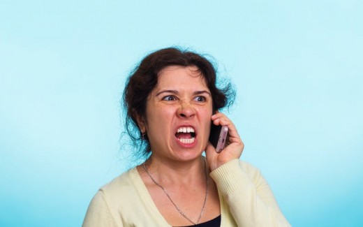 Woman is annoyed by a robocall, and it is probably not the first one she received on that day.