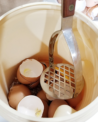 First, break down large eggshells into smaller pieces.