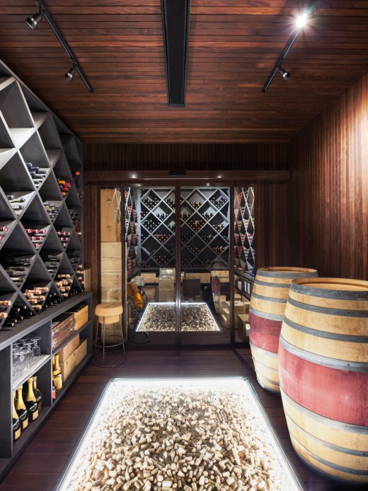 Modern cellar with a creative cork display on the floor accentuated with LED strip lights. 