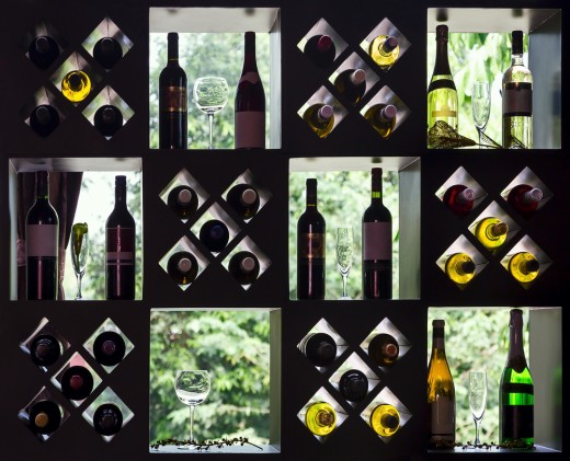 Chic wine rack placed over a glazed window. The natural light serves as back lighting.