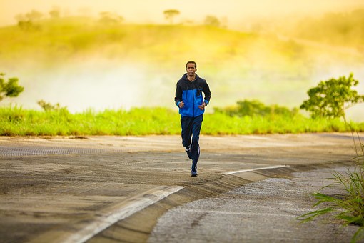 A man jogging for strength, fitness, and endurance