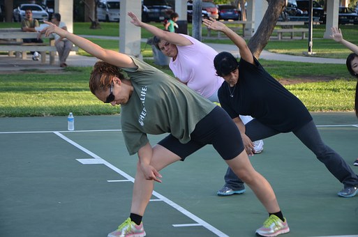 A young woman learning stretching exercise