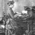 A woman operating a typewriter