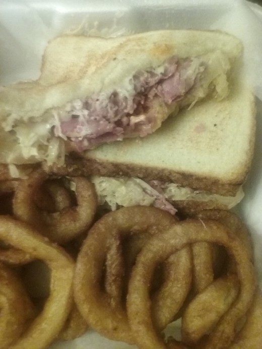 Reuben corned beef sandwich with onion rings from Jam's Deli 
