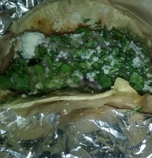 Topped with a generous amount of cilantro - soft taco from Qdoba Grill 