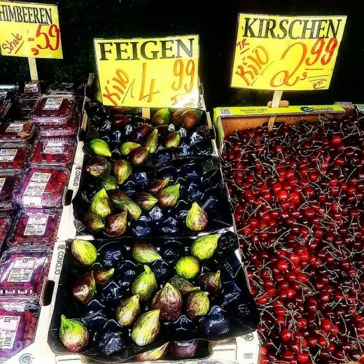 Figs and cherries for sale at the local market.