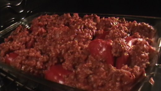 Stuff the red peppers with the mixture and lay evenly in a baking dish. Spread extra mixture evenly in baking dish.