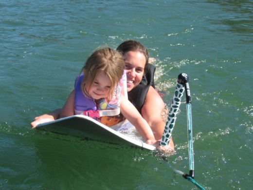 Helping a little lady learn to surf.