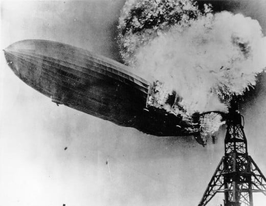Explosion of the air passenger Zeppelin the Hindenburg at Lakehurst, New Jersey on May 6, 1937 (Source: Public Domain photo taken by U.S. Navy photographer on duty at time.  Courtesy of WikiPedia Commons)