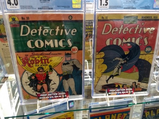 Two early issues of Detective Comics starring Bat-Man. The issue on the left was the debut of Robin. 