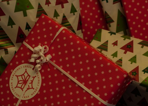 Keep your holiday wrapping paper protected from getting crushed by storing it in a variety of boxes or bags.
