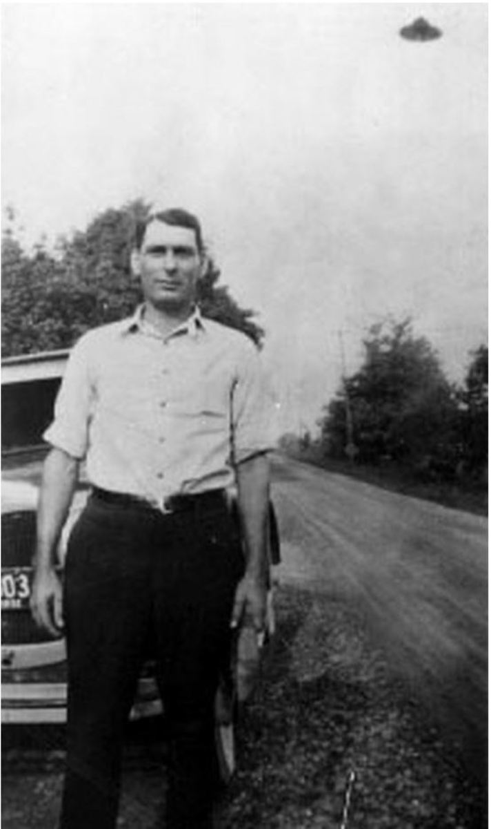 George Sutton in St. Paris in Northwestern Ohio with UFO in background in 1932.