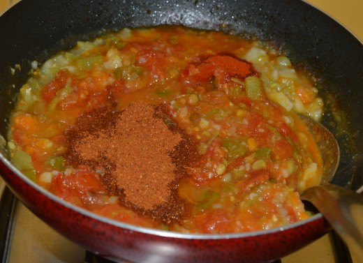 Step three: Add Pav bhaji masala, red chili powder, and salt. Continue cooking for a minute. Add mashed vegetables. Also add a teaspoon full of butter. Put off the heat.