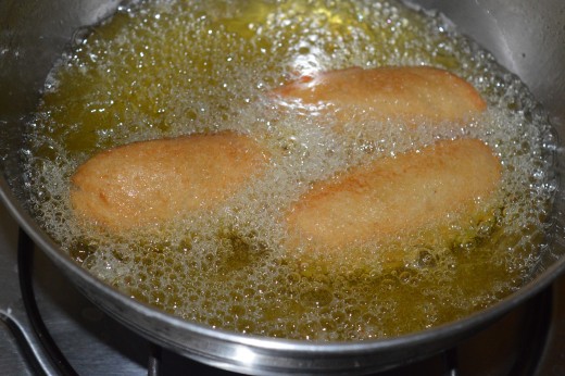 Step four: Deep fry them in the oil to get vegetable bread rolls