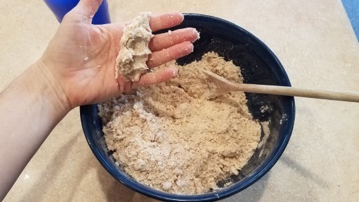 Mix in water until dough holds together when squeezed.
