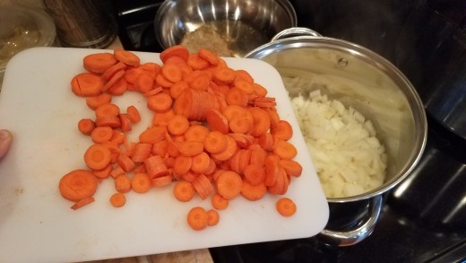 Chop your carrots and dump them into your pot. Cook until both are soft.