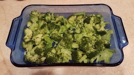 Dump your broccoli into your casserole dish and spread it out evenly.