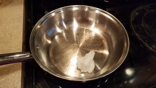 Start by melting your coconut oil in a large saute pan.
