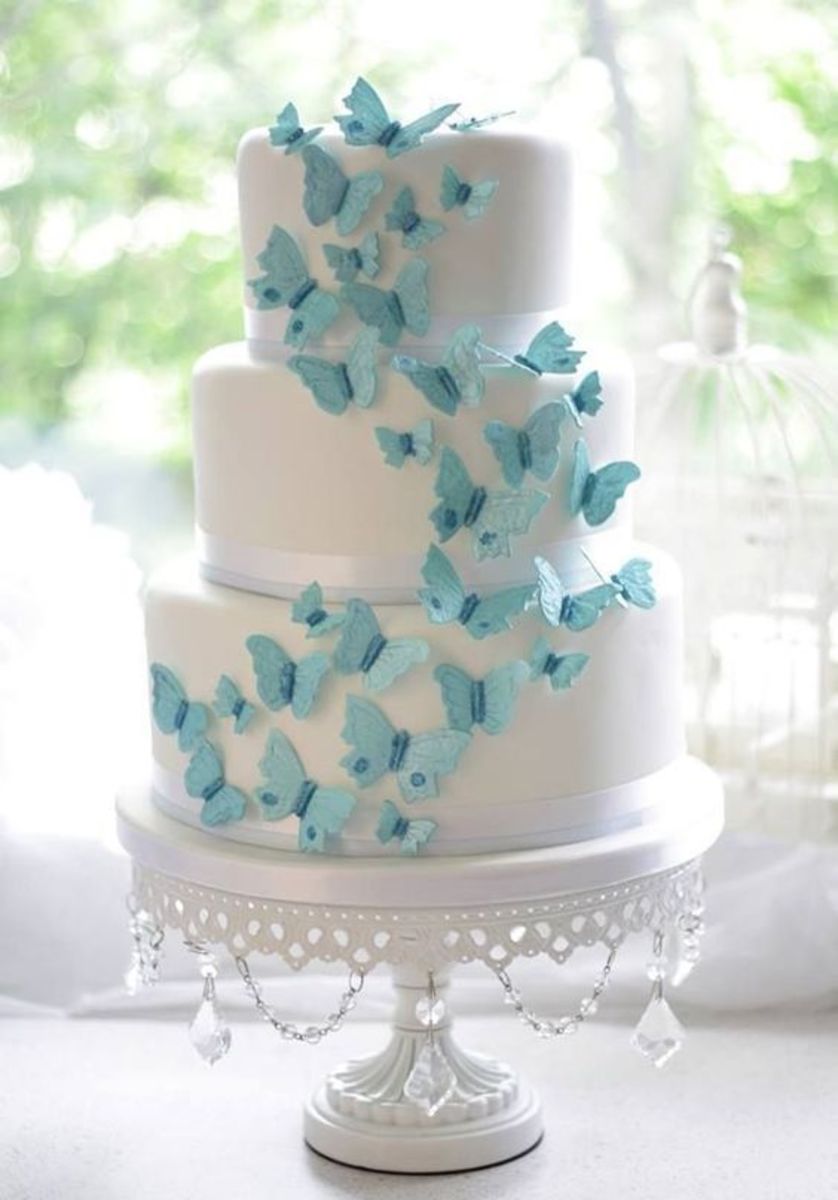 Add butterflies in the colors of your choice rising on the layers of your cake