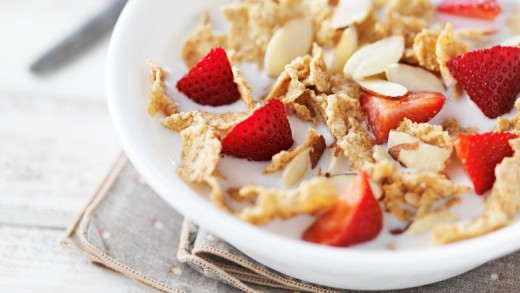 Bowl of cereal with strawberries and almonds