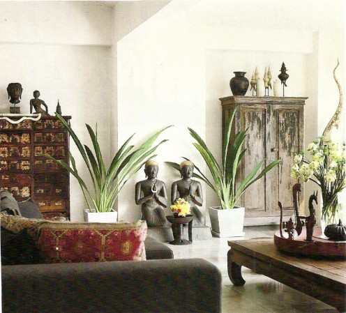 Light and dark colors, heavy and delicate furnishings give this Asian-inspired room and exotic feel.