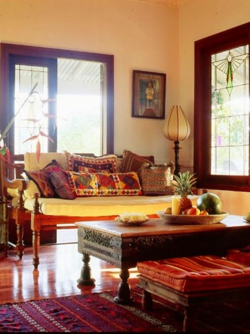 Intense colors and beautifully carved mahogany furniture gives the room a comfortable elegance.