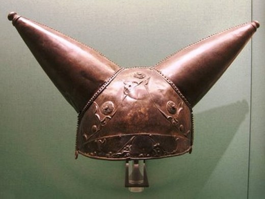 Celtic horned helmet - did it put the frighteners on raw Roman recruits? Imagine a tall, muscular, moustached warrior hurtling along, roaring war blood-curdling war cries on a chariot fitted with scythes on its wheels - which is more frightening?