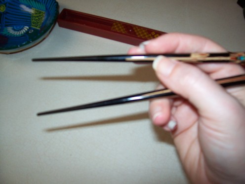 Holding them closer to the end gives you a wider range of motion.