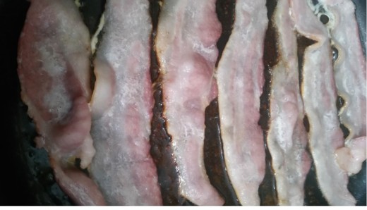 bacon in frying pan on medium heat