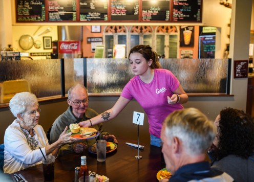 The waitress is always having to smile although she is hurting inside.