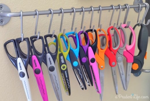 Use a simple rail and hook storage system to store scissors