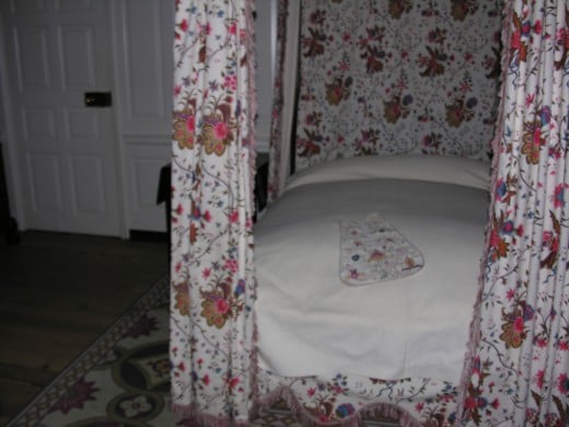 A bed inside the Governor's Palace.