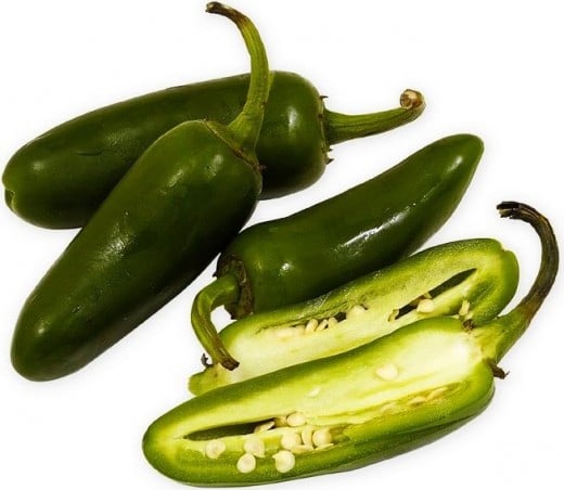 The Heat from a Jalapeno comes from the pith and seeds. 