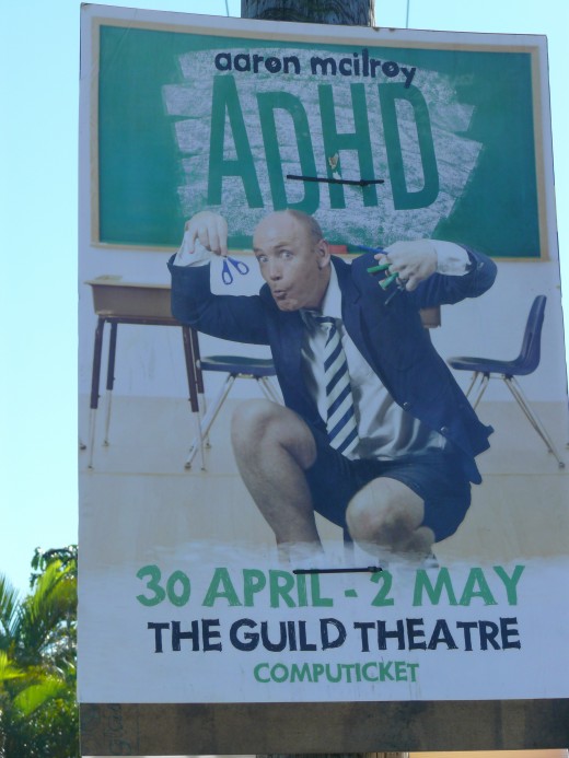 Among the election posters a well known SA Comedian advertises his show.