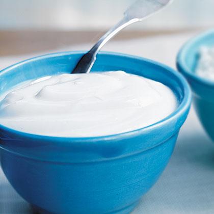 Plain, wholesome yogurt in a blue bowl.