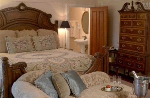 One of the overnight guest rooms, featuring antiques and country charm