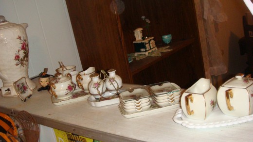 A miniture tea set with matching finger bowl, ash trays, creamer & sugar bowls!