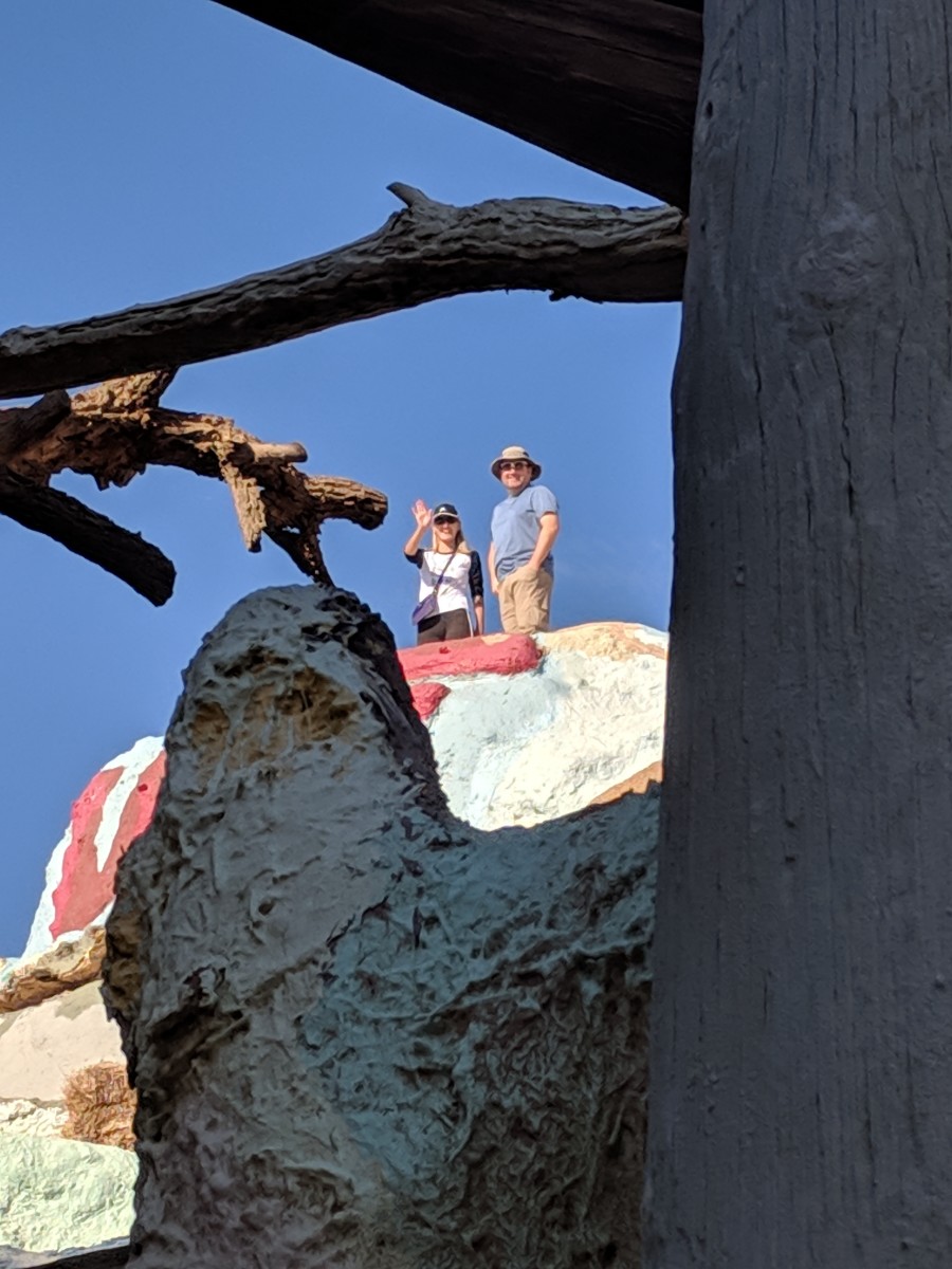 Looking up at our daughter and her husband standing on top of Salvation Mountain