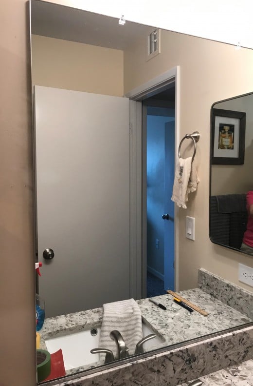 Walk into a new or flipped home and this is often what you see; a plain contractor grade mirror.