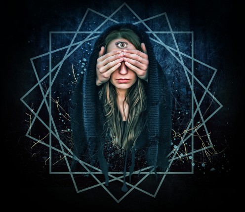 This photo symbolizes using a part of your body to open up your sense to what is out there in this world. This woman is using her third eye chakra. 