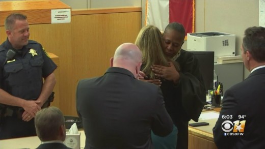 Judge Tammy Kemp hugs Amber Guyger