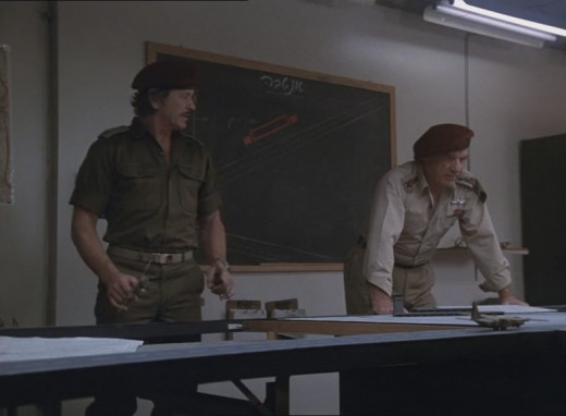 Bronson plots his next move in Raid on Entebbe. 