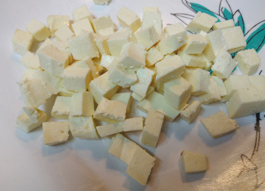 Cut paneer into equal sized cubes. Keep aside.