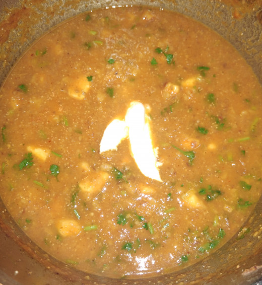 Add 1-2 teaspoons of fresh cream. Gently mix the cream in the gravy.